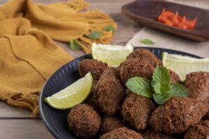 Traditional Arabian fried snack made with wheat and stuffed with minced meat. Quibe.